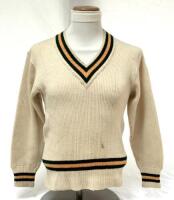 Ross Gerald Gregory, Victoria & Australia, 1933-1939. Australian Test long- sleeved sweater worn by Gregory during his brief Test playing career. The sweater by ‘Farmer’s Sydney’, with his name handwritten to label, with green and gold trim to neck, waist