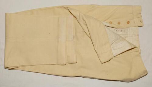 George Edward Tribe. Victoria, Northamptonshire & Australia 1945-1959. A pair of cream cricket flannels (trousers) worn by Tribe during his playing career. The flannels by Austin Reeds, have a buttoned fly with turn-up to leg. Odd small moth hole otherwis