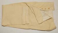 George Edward Tribe. Victoria, Northamptonshire & Australia 1945-1959. A pair of cream cricket flannels (trousers) worn by Tribe during his playing career. The flannels by Austin Reeds, have a buttoned fly with turn-up to leg. Odd small moth hole otherwis