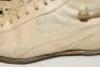 Max Walker. Australia. A pair of Puma cricket boots with leather uppers and soles, match worn by Walker. Both boots signed and presented to David Frith by Walker, one appears to be dated &lsquo;75&rsquo;. Good condition - 2