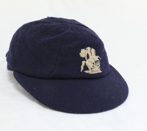 Kumar Shri Duleepsinhji. Sussex & England 1924-1932. M.C.C./England navy blue cloth Test touring cap, by E.C. Devereux of Eton, with excellent embroidered touring emblem of St. George & Dragon. His name ‘K.S. Duleepsinhji’ inscribed in black ink to the in