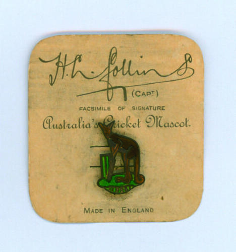 Australian tour of England 1926. ‘Australia’s Cricket Mascot’. Original lapel badge depicting a kangaroo batsman, in brown enamel, holding a cricket bat and standing in front of the wicket with ‘1926’ in a scroll below. The field in green enamel. The badg