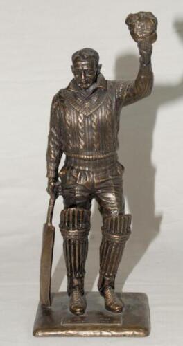 ‘The Final Salute. Sir Don Bradman 1908-2001’. Resin figure by Tanya Bartlett of Bradman wearing batting attire, standing full length, one hand resting on his bat, the other holding his cap aloft. Limited edition of 1000 copies. Based on the artist’s full