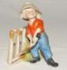 ‘The Hope of his Side‚‘. Kinsella 5.5” caricature spill vase of a young boy in batting stance in front of the wickets. Printed title below wickets and bat. ‘Copyright’ stamp to base. German circa early 1900’s. Very minor chip to the boy’s hat otherwise in