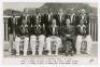 ‘West Indies vs M.C.C. Trinidad 1954. 4th Test’. Rare real photograph plain back postcard of the West Indies team seated and standing in rows wearing cricket attire and blazers for the 4th Test, Port of Spain, 17th- 23rd March 1954. Printed title and play