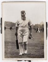 William Gilbert Grace, Gloucestershire, London County & England 1870-1908. Mono original photograph of Grace walking out to bat. 6”x8”. Laid down to board, and detached from later mount, overall 8.5”x11”. Excellent image. Some scratches to original negati