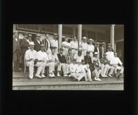 W.G. Grace 1900. Original glass plate/ magic lantern slide of an image of W.G. Grace seated and surrounded by players on the steps of the pavilion at Crystal Palace in 1900. The players appear to correspond with the match London County v Warwickshire, 20t