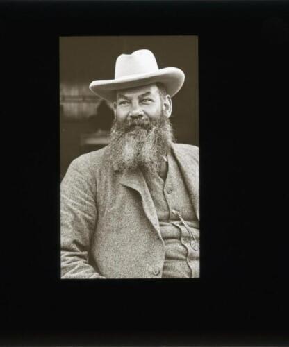 W.G. Grace 1900. Original glass plate/ magic lantern slide of an image of W.G. Grace, half length wearing a suit and hat, probably taken on the steps of the Crystal Palace cricket pavilion. The plate measures 3.25” square. An excellent unpublished image o