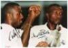 West Indies. Colour photograph of Garry Sobers in batting action signed to the photograph by Sobers. 8.25”x6”. A colour photograph of Courtney Walsh and Curtley Ambrose celebrating winning the Wisden Trophy, the photograph signed by both players, 10”x7”. - 2