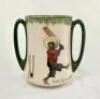 ‘Out for a Duck’ and ‘There’s Style!’. Royal Doulton Black Boy tall two handled ‘loving cup’ mug with two different images and titles, printed to one side, with a boy cricketer in red shirt, grey trousers and a floppy hat in batting pose having attempted 