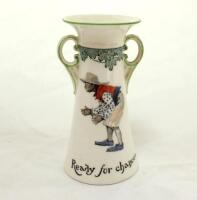 ‘Ready For Chances’. A Royal Doulton Black Boy tall two handled vase, printed with a boy in spotted shirt, red waistcoat and a floppy hat, crouched awaiting a catch (as if in the slips), entitled ‘Ready For Chances’ and to verso, the crest ‘The All Black 