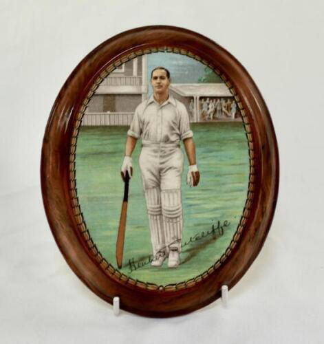 Herbert Sutcliffe. Yorkshire & England 1919-1945. New Hall Pottery ceramic oval plaque printed with a portrait of Sutcliffe walking out to bat with stands and crowd to background, printed signature below, with a decorative and wood effect rim. 5.5”x6.5”. 