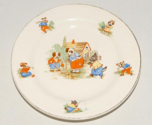 Childs sporting plate. Ceramic plate with centre piece of three dogs playing cricket, with borders showing five animals playing different sports including cricket. 7” diameter. ‘Staffs Teaset Ltd’, Tunstall. Sold with a ‘Patum Peperium’ circular dish and