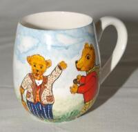 Cricket mug. A small hand painted china mug by Joan Allen featuring two teddy bears, one holding a bat, waving, the other holding a cricket ball. Approx.3.5” tall. G/VG