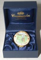 Cricket pillbox. ‘Gieves & Hawkes. No 1 Savile Row, London’. Modern enamelled circular pillbox hand decorated with an image of a batsman in batting pose in batting pose. In original presentation box. Produced by Crummles. 1.75” diameter. Not previously se