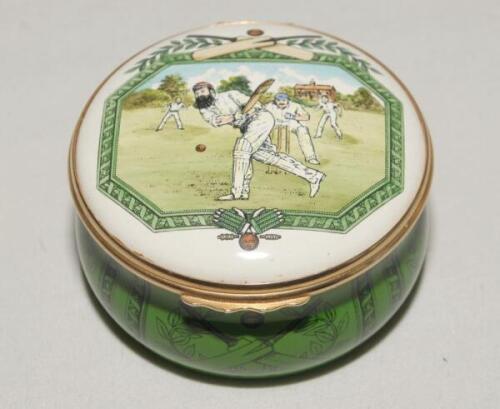 ‘Village Cricket Match’. Halcyon Days circular enamel on copper pill box. The lid of the pill box decorated with W.G.Grace batting with pavilion and trees to background, details to the inside of the lid ‘A Village cricket match at the turn of the 19th Cen