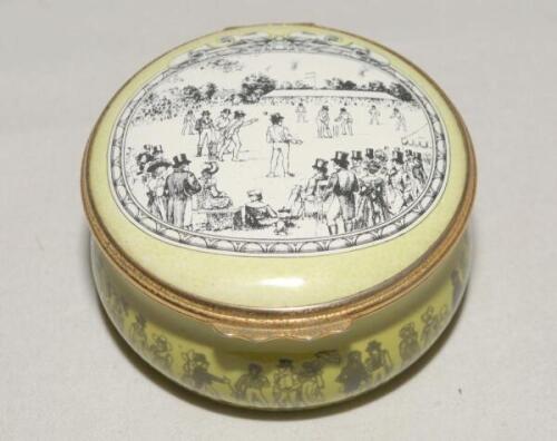 ‘Cricket at Lord’s’. Halcyon Days circular enamelled pill box. The lid with scene of Lord’s at the beginning of the 19th Century, the hinged lid revealing title ‘Cricket at Lord’s in the early 19th Century’ and small vignette of a cricketer in top hat. Th