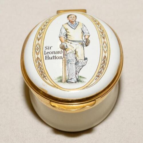 Cricket pillbox. Sir Leonard Hutton. Modern enamelled oval white and cream pillbox hand decorated with a portrait of Hutton full length in cricket attire walking out to bat . Stumps with bails decoration to inside lid. Produced by Crummles. VG