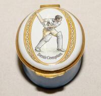 Cricket pillbox. Denis Compton. Modern enamelled oval white and blue pillbox hand decorated with a portrait of Compton playing a drive. Bat, pad and ball decoration to inside lid. Produced by Crummles. VG