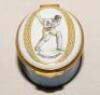 Cricket pillbox. Denis Compton. Modern enamelled oval white and blue pillbox hand decorated with a portrait of Compton playing a drive. Bat, pad and ball decoration to inside lid. Produced by Crummles. VG