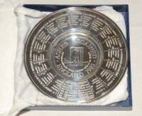 ‘Ashes Regained. England 1985’. Silver plate dish with title to centre, Test match results and players names and biographies to borders. 6” diameter. In original presentation box. VG