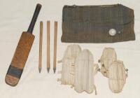 Miniature cricket equipment. An unusual collection comprising a set of three miniature stumps 6.5” tall, two pairs of leg guards and a ceramic ball, all contained within an cloth cricket bag, and a miniature bat, 10.5”. Sold with a full size pair of brown