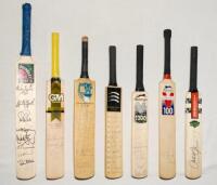 Signed miniature cricket bats. Seven miniature bats including two signed by county teams with county emblems for Gloucestershire 1989, 14 signatures, 16”, and Middlesex c.2003 12 signatures, 15”. Boundary Sports bat signed by eight international cricketer