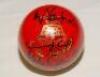 ‘Readers’ signed cricket ball. A half red, half white cricket ball, signed by Shane Warne, Brian Lara, Ian Botham, Mike Gatting, Michael Vaughan and Andrew Strauss. VG - 2