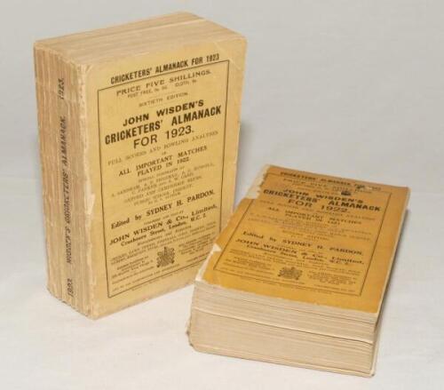 Wisden Cricketers’ Almanack 1922 and 1923. 59th and 60th editions. The 1922 edition with broken spine block, the book in two clean halves, wear and loss to wrappers and to spine paper, ink staining to page block edge, contents good. The 1923 edition with 