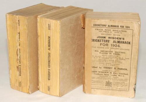 Wisden Cricketers’ Almanack 1924, 1927 and 1928. 61st, 64th and 65th editions. The 1924 edition with replacement spine paper, broken spine block, worn and faded wrappers, rear wrapper detached, ink stain to page block edge, loss of replacement spine, cont