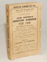 Wisden Cricketers‚‘ Almanack 1918. 55th edition. Original paper wrappers. Wear and age toning to wrappers, crease to front wrapper and some wear with odd nick to wrapper extremities, wear to spine paper with some loss otherwise in good condition. Rare war