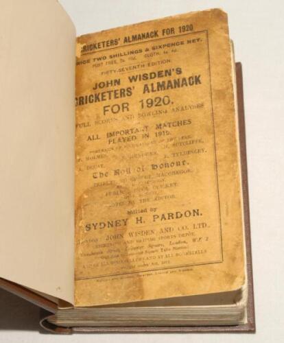 Wisden Cricketers‚‘ Almanack 1920 and 1921. 57th & 58th editions. Both editions bound in dark brown boards, with original paper wrappers, with gilt titles to spine. Both editions with wear, soiling, staining and nicks to wrappers, soiling to the page bloc