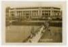 Wimbledon Championships 1920s. Rare original and early sepia real photograph postcard of a ‘View of Stands’ with the Centre Court in the background with matches in progress on outer courts to foreground. Blind embossed stamp for Edwin Trim & Co. of Wimble