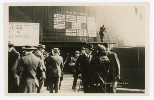 ‘Wimbledon 1914’. Rare original mono real photograph postcard showing the Plan of Courts and matches on the stand sides, with spectators to the foreground. Card no. O23 in a series issued by Edwin Trim & Co. of Wimbledon, with publishers name printed to r