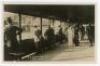 ‘Wimbledon 1914’. Rare original mono real photograph postcard showing spectators standing in a walkway/stand overlooking an outside court. Title to card ‘Wimbledon Tennis 1914’. Card no. O75 in a series issued by Edwin Trim & Co. of Wimbledon, with publi