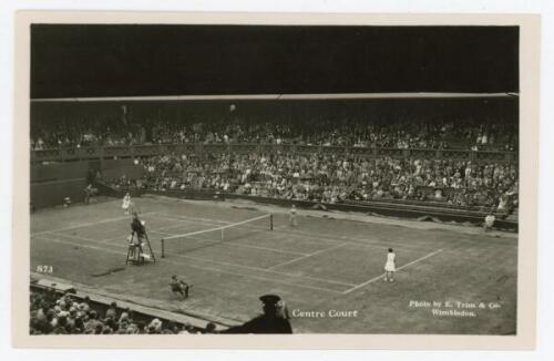 ‘Wimbledon Centre Court’ circa early 1930s. Original mono action real photograph postcard with a ladies singles match in progress. Card no. S73 in a series issued by Edwin Trim & Co. of Wimbledon, publishers name printed to lower corner. Postally unused. 