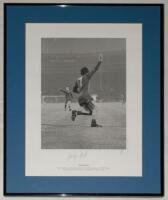 George Best. Manchester United ‘European Cup Winners’ 1968. Mono limited edition print of George Best turning to celebrate having scored United’s second goal in the Final against Benfica at Wembley in 1968. Nicely signed to lower border in pencil by Best.