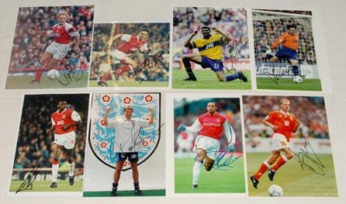 Arsenal F.C. signed photographs 1990s-2000s. Eight original colour press photographs of Arsenal players, each signed by the featured player. Signatures are Henry, Adams, Bergkamp, Vieira, Parlour, Overmars, Kanu and Seaman. One with Associated Sports stam