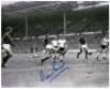 World Cup Final 1966. England v West Germany. Two copy press photographs of match action, one a colour photograph signed by George Cohen, the other black and white signed by Martin Peters. Both 10”x8”. VG - 2