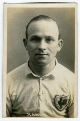 Samuel Ernest Brooks. Tottenham Hotspur 1922-1924. Mono real photograph postcard of Brooks, half length, in Spurs shirt. Name to lower border. W.J. Crawford of Edmonton. Very good condition Postally unused