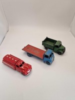 A collection of Dinky diecast models x 3 unboxed comprising of Dinky #512 Guy Flat Truck Blue/Red (1st Type Cab) Blue cab, chassis and wheels. Red back. Produced from: 1948-1955 DINKY #30p / 442 STUDEBAKER RED ESSO PETROL TANKER Produced 1952-60 and Dinky