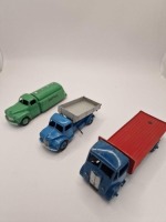 A collection of Dinky diecast models x 3 unboxed comprising of Dinky #512 Guy Flat Truck Blue/Red (1st Type Cab) Blue cab, chassis and wheels. Red back. Produced from: 1948-1955 dinky #414 Rear Tipping Wagon Blue/Grey produced from 1955-1963 and Dinky #30