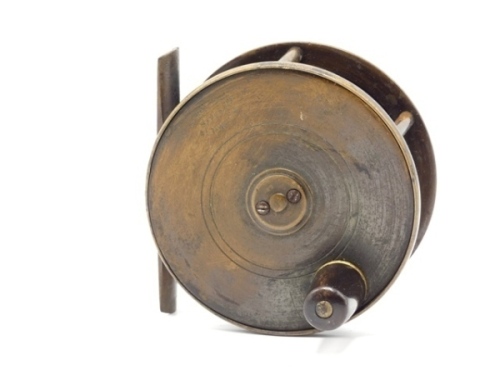 An early Hardy Birmingham brass 3 ½" light salmon fly reel, tapered horn handle, bridge foot, quadruple cage pillars, fixed check mechanism, faceplate with raised two screw spindle boss and stamped open oval logo, light wear from normal use, circa 1890