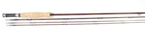 A scarce Orvis "Bakelite" 3 piece (2 tips) impregnated cane trout fly rod, 9', black silk wraps, alloy screw grip reel fitting, serial no. 1017, suction joints, in bag and alloy tube