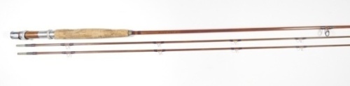 A scarce Orvis "Wes Jordan" 2 piece (2 tips) impregnated cane fly rod, 8', #8, 4 ?oz, crimson whippings, walnut reel seat with alloy screw grip fitting, suction joints, Carboloy butt rings, snake eyes, serial no. 64152, in bag and original leather covere