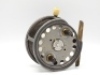 A Hardy Silex No.2 4 ¼" wide drummed bait casting reel, twin ebonite handles, three screw spring latch, brass foot, cut-away rim section, rim mounted ivorine casting trigger and milled brass tension adjuster with rear weight indicator, wear from normal u