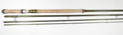 A Loomis "Stinger GLX" 4 piece carbon salmon fly rod, 15', 45g, green silk wraps, anodised screw grip reel fitting, ivorine reel seat with fly motif, light use only, in cordura tube