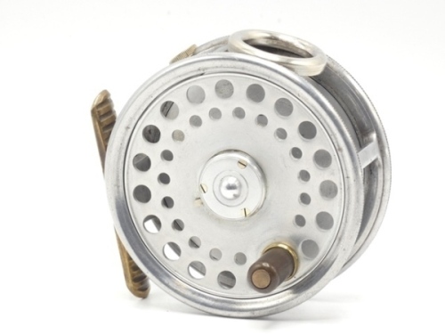 A scarce Hardy St. George 3" trout fly reel, bright alloy finish, ebonite handle, ribbed brass foot, three screw drum latch, milled nickel silver rim tension screw and Mk.II check mechanism, interior stamped "J.S." (Jimmy Smith), light wear from normal u