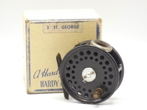 A good Hardy St George 3" trout fly reel and card box, ebonite handle, ribbed brass foot, two screw drum latch, white agate line guide (no cracks), milled rim tension screw and Mk.II check mechanism, only light wear to enamel finish, 1950's