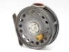 A scarce Hardy St George 3 ¾" 2nd model trout fly reel, ivorine handle, brass foot, red agate line guide (no cracks), shallow cored drum with ventilated arbour and three screw spring release latch, strapped rim tension screw and single spring 1913 check 